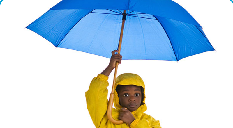 a boy holding an umbrella
