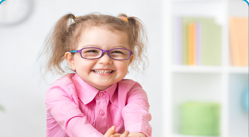 a smiling child with glasses